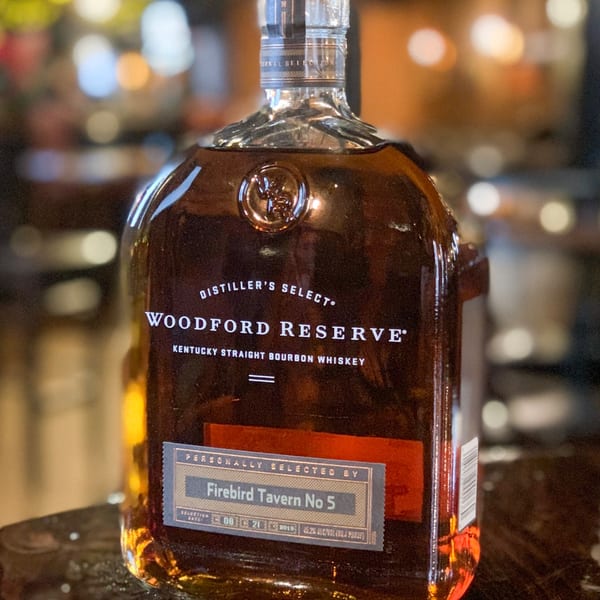 A bottle of Woodford Reserve bourbon, personally selected by Firebird Tavern No 5.